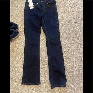 Silver Jeans Elyse mid rise dark wash jeans.